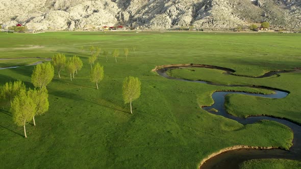 Green Field High in the Mountains of Turkey Filmed on a Drone