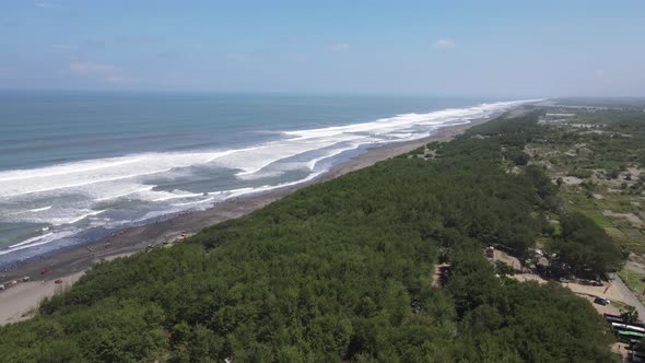 Aerial view of people holiday in parangtritis beach, Indonesia