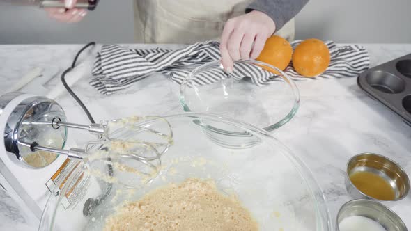 Step by step. Mixing ingredients in a mixing bowl to bake cranberry muffins.