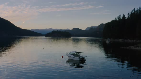 A White Speedboat Anchored At The Sechelt Inlet - Pacific Ocean Fjord On The Sunshine Coast Near Egm