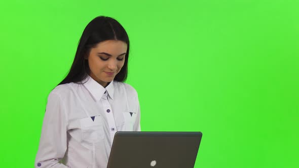 Beautiful Cheerful Businesswoman Working on Her Laptop