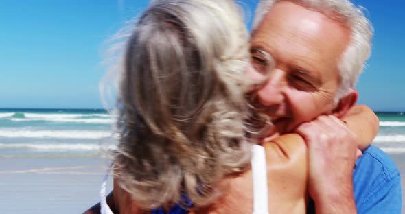 Senior couple hugging each other at the beach