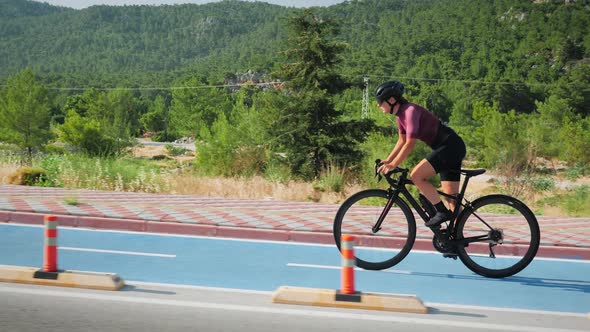 Female cyclist riding bicycle