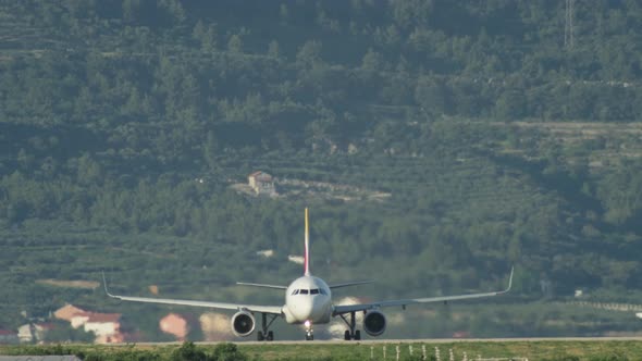 A Passenger Plane is Traveling on the Runway