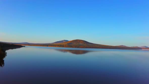 Aerial Video of Beautiful Mountain Lake on a Frosty Autumn Morning.