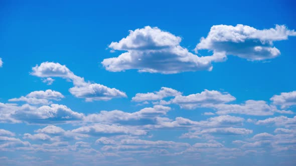 Timelapse of White Clouds Move and Dissolve in the Blue Sky Cloudy Space