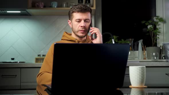 Man Talking Smartphone at Home Office