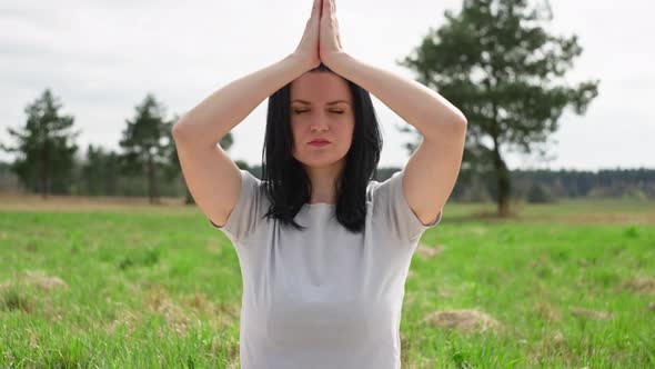 Healthy Lifestyle Girl Practicing Yoga Alone with Nature