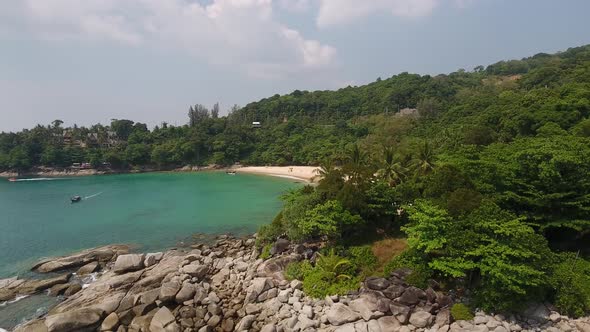 Aerial side reveal shot of a beautiful beach in southern Thailand