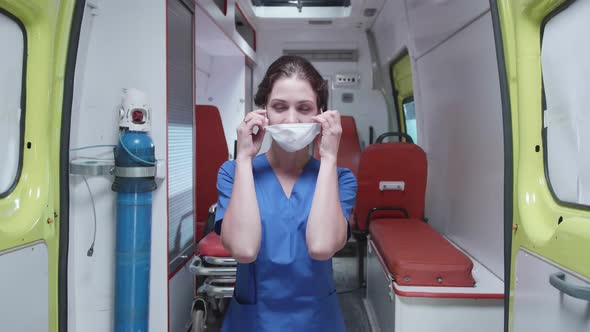 Woman Put Off Respiratory Mask, Look and Smile.