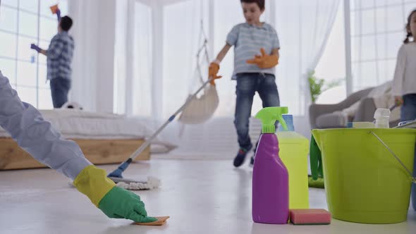 Family with Kids Doing Household Chores Together