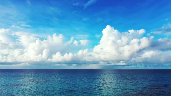 Aerial above seascape of idyllic sea view beach lifestyle by aqua blue sea with white sand backgroun