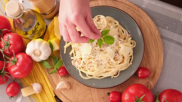 Making Pasta Carbonara  Pouring Fresh Basil to Parmesan Cheese Spaghetti Ceramic Dish