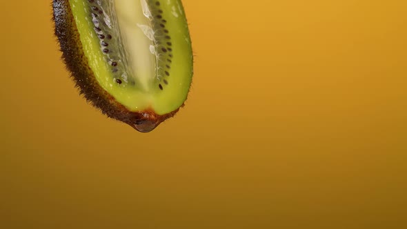 Fresh Kiwi on an Orange Background