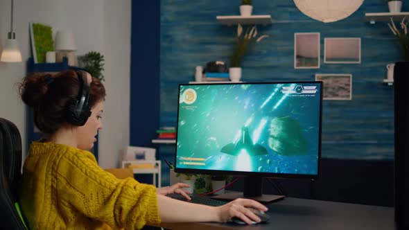 Expert Woman Gamer Playing Space Shooter Video Game