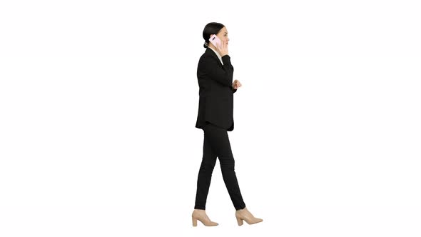 Bossy Businesswoman Talking on Her Phone on White Background