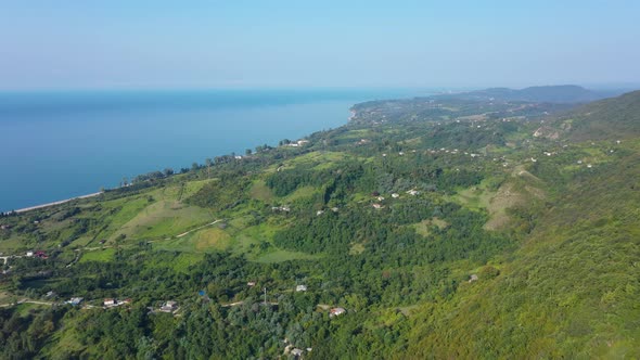 Seashore View Landscape with Green Forest and Red Roofs of the Houses in New Athos Abkhazia Georgia