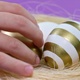 Happy Easter Close Up. Kid Take Golden Egg From The Nest on Purple Background. - VideoHive Item for Sale