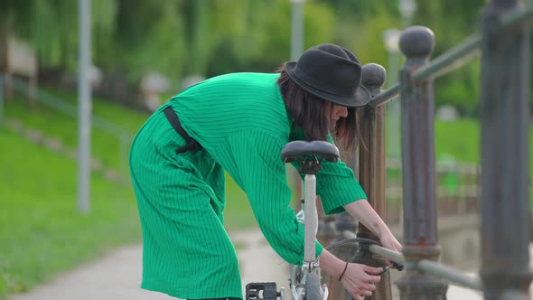 Girl locking her bike and walking away