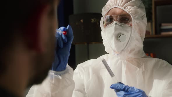 PCR Test Process Doctor Medical Staff Worker Wearing Protective Equipment Takes Sample From Nose of