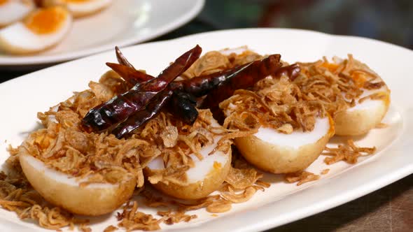 Close-up Footage of Son In Law Egg (Kai Look Kuey), Deep Fried Egg with Sweet and Sour Tamarind Sauc