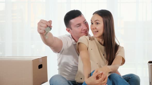 Happy Couple Makes Selfie with Keys To Amazing New House