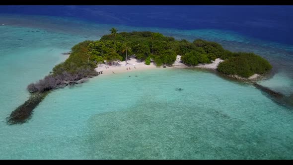 Aerial seascape of paradise coastline beach holiday by shallow lagoon with white sandy background of