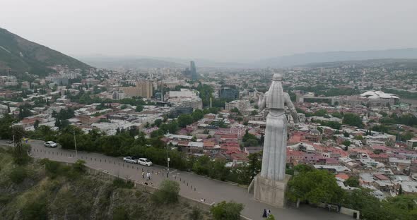 Panorama of the Tbilisi and the back of Kartlis Deda statue during daytime.