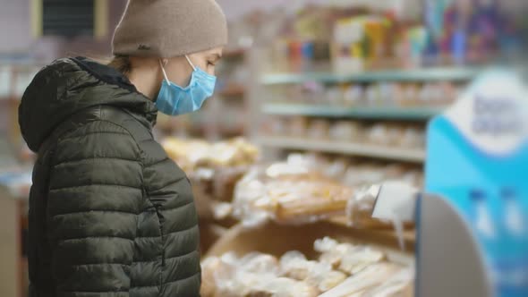 Woman in Medical Mask at the Supermarket