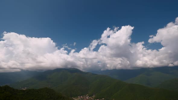 Clouds Above Green Mountain Peaks Time Lapse