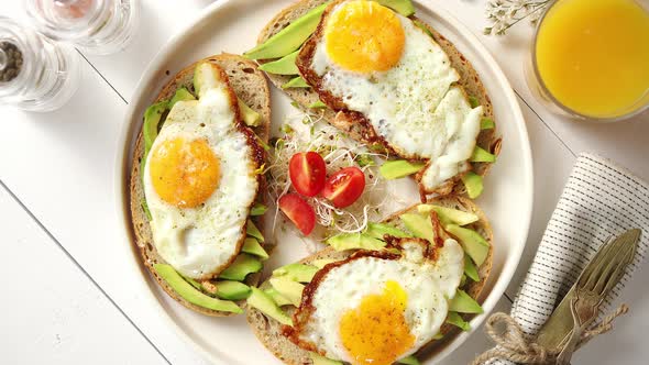 Delicious Healthy Breakfast with Sliced Avocado Sandwiches with Fried Egg