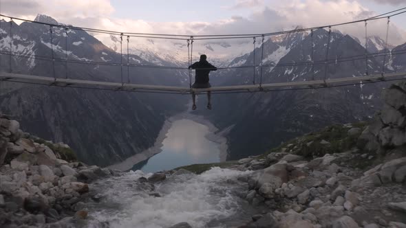 Aerial view of a person looking the Alps landscape, Italy.