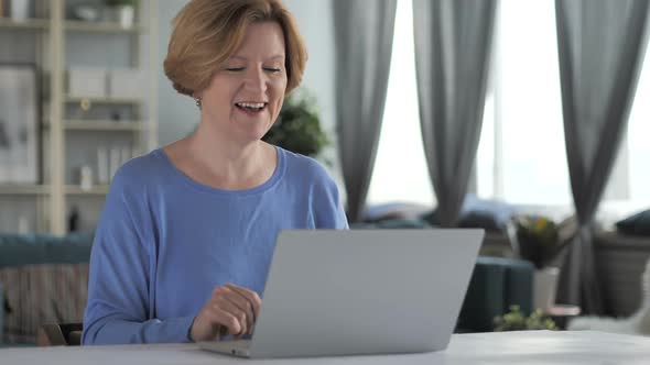 Online Video Chat on Laptop By Senior Woman