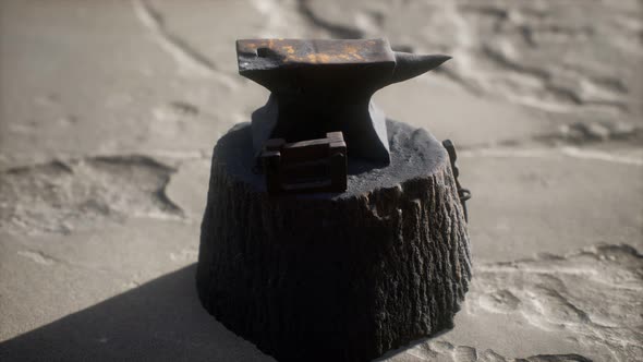 Old Anvil Attached To a Stump