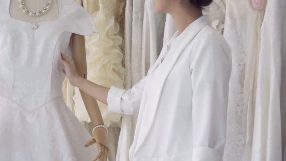 Future Bride Choosing Wedding Dress for Her Upcoming Wedding Ceremony