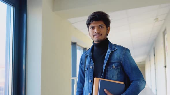 Indian Student with a Books in the University