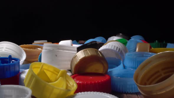 Used plastic water bottle caps. Collection, separates, sorting, plastic waste for recycling