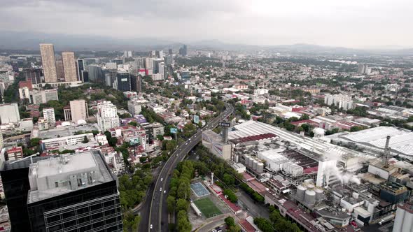 drone shot of a beer factory in the industrial heart of mexico city