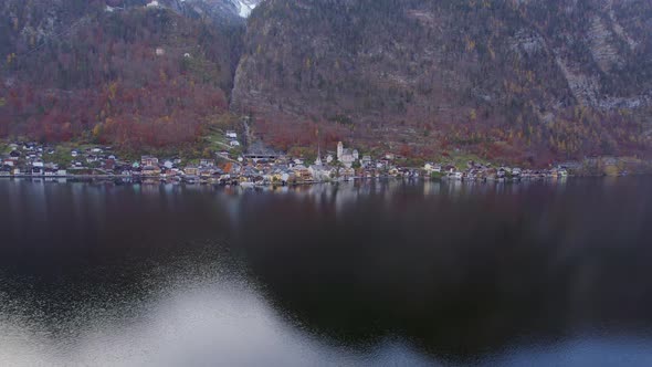 Flying Over the Lake Towards the Town of Hallstatt in Austria