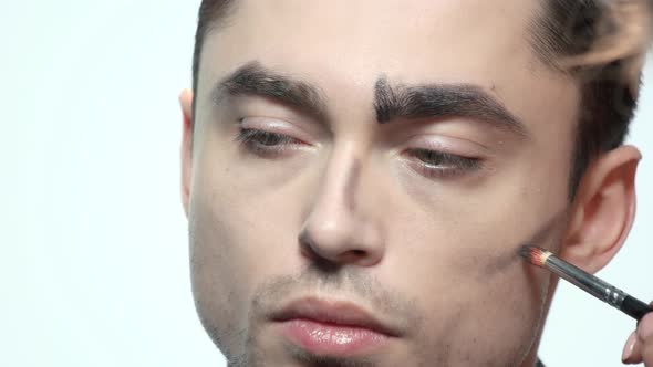 Brush Applying Makeup, Male Face