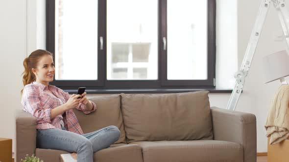 Couple Opening Bottle of Champagne at New Home