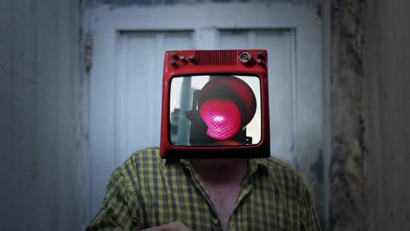 Elderly Man with an Old TV Instead of Head, showing a Red Traffic Light on Screen.