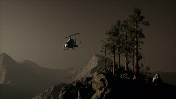 Extreme Slow Motion Flying Helicopter Near Mountain Forest alt