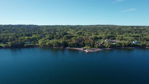 Drone aerial view of Lake Superior shoreline in front of Glensheen Mansion