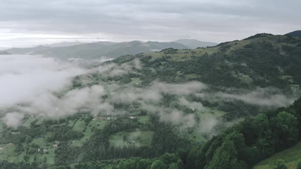 Drone Over Fog Clouds at Mountain Village