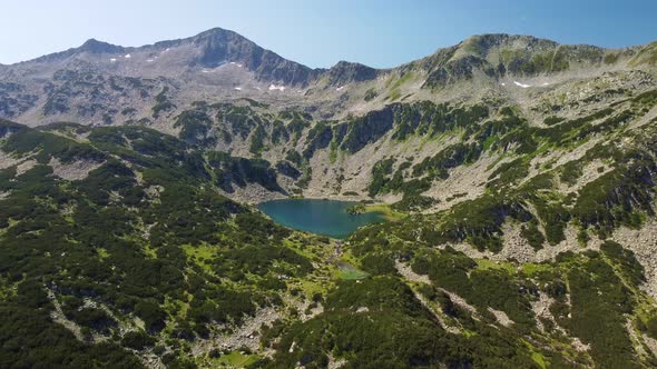 Aerial View of a Lake in the Pirin Mountains with Blue Clear Water