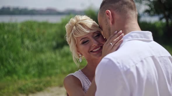 Beautiful Smiling Bride Embracing Her Husband