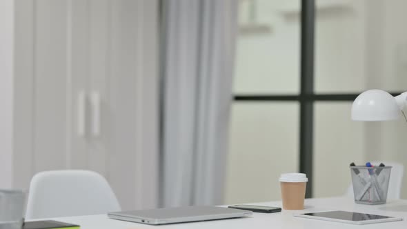 Young Woman Coming Back Opening Laptop at Work 