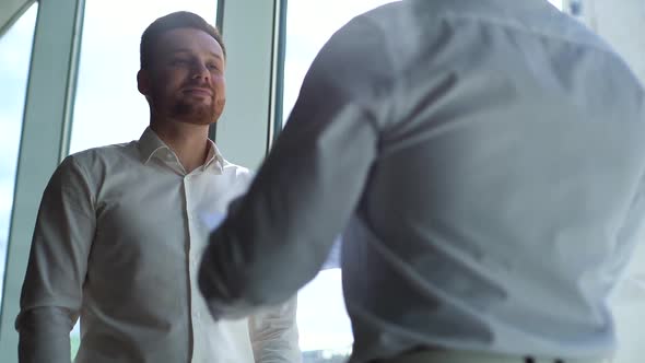 Tracking Shot of Caucasian Businessman and African Businessman Agreed Contract and Shaking Hands