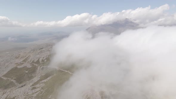 Scenic aerial view of moving white clouds at Abuli Mountain. Georgia